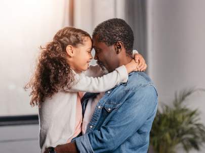 A father and daughter hugging